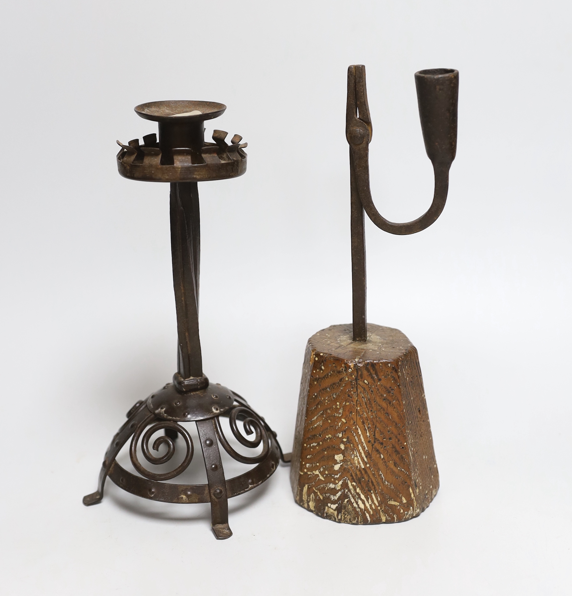 An 18th century rushlight and a wrought iron candlestick, rush light 26cm high